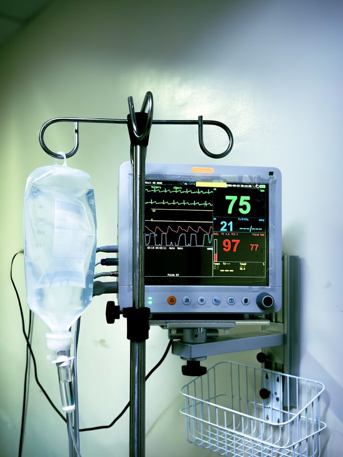 project-02-c Medical equipment in use, showing vitals on a monitor next to an IV drip in a Cebu City healthcare facility.